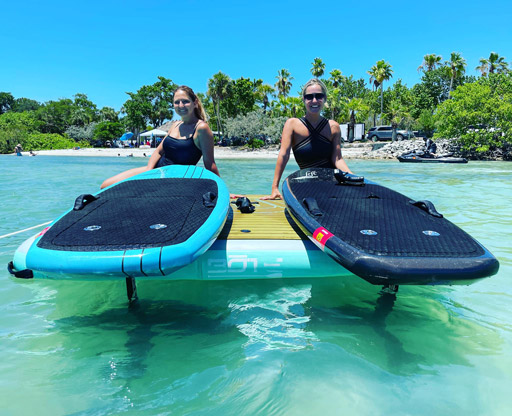 Two women on eFoils